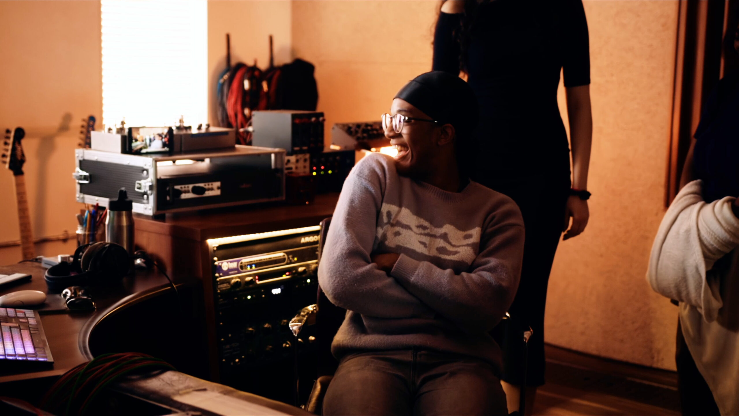 Smiling artist in a studio, still from Crucial Moves